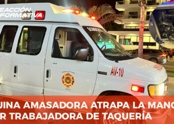 Maquina amasadora atrapa la mano de mujer trabajadora de taquería